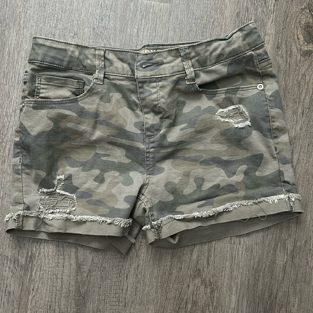 Never been worn, children’s size 16 camo denim shorts.